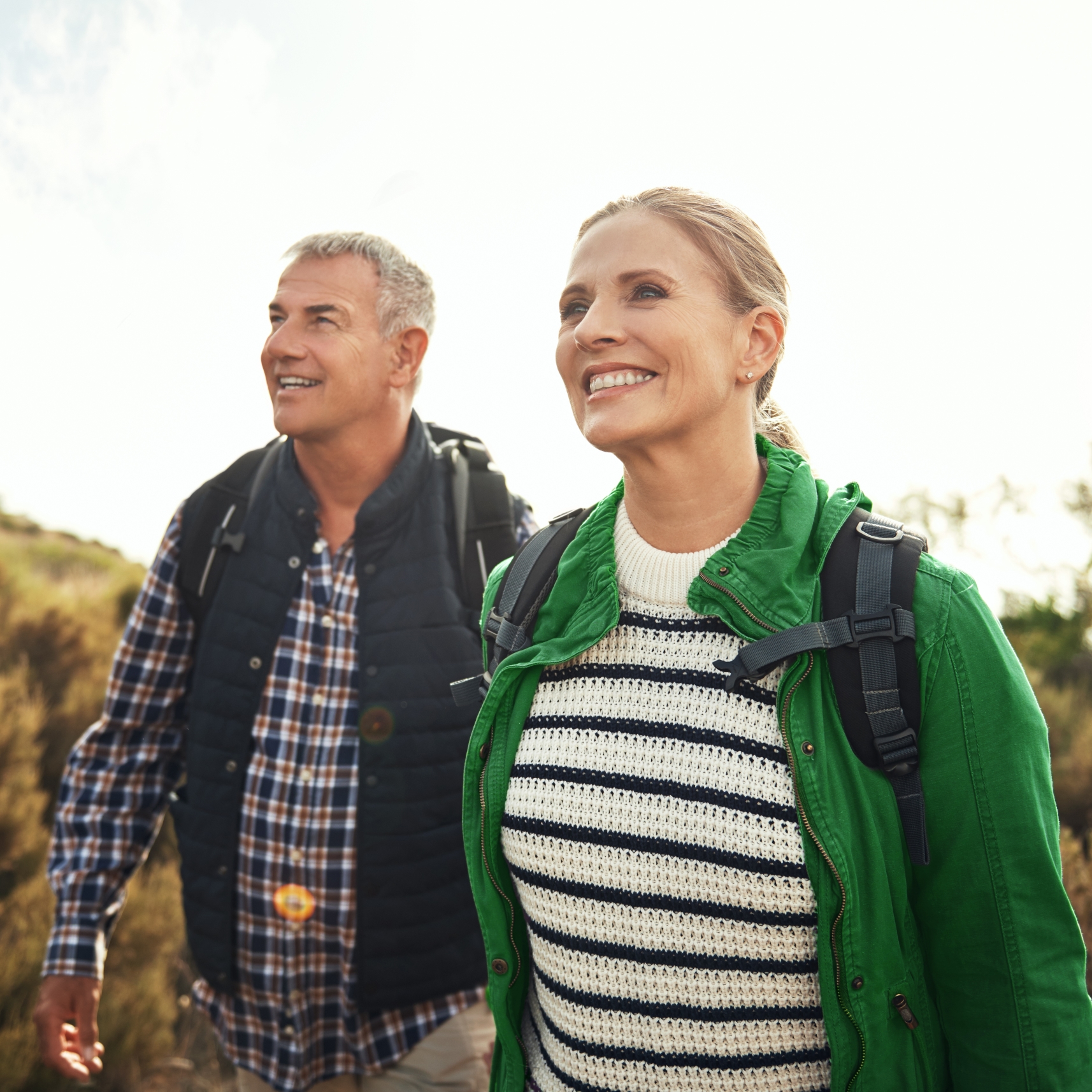 Elderly couple enjoying a hike.